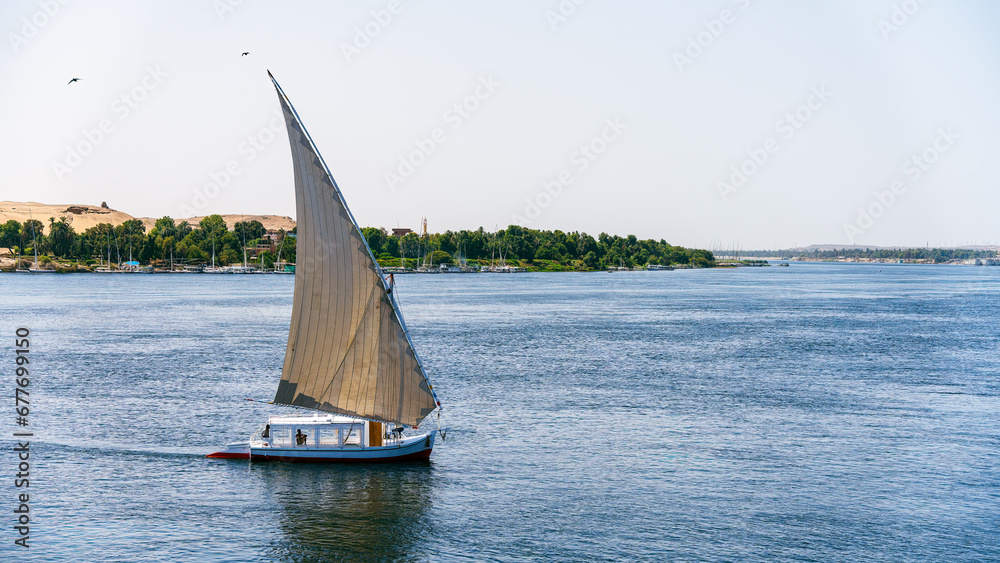 Fototapeta premium Feluca sailing on the River Nile in Egypt