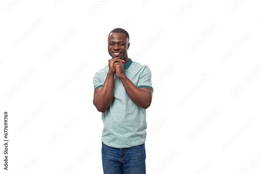 young charismatic american guy dressed in a mint t-shirt on a white background