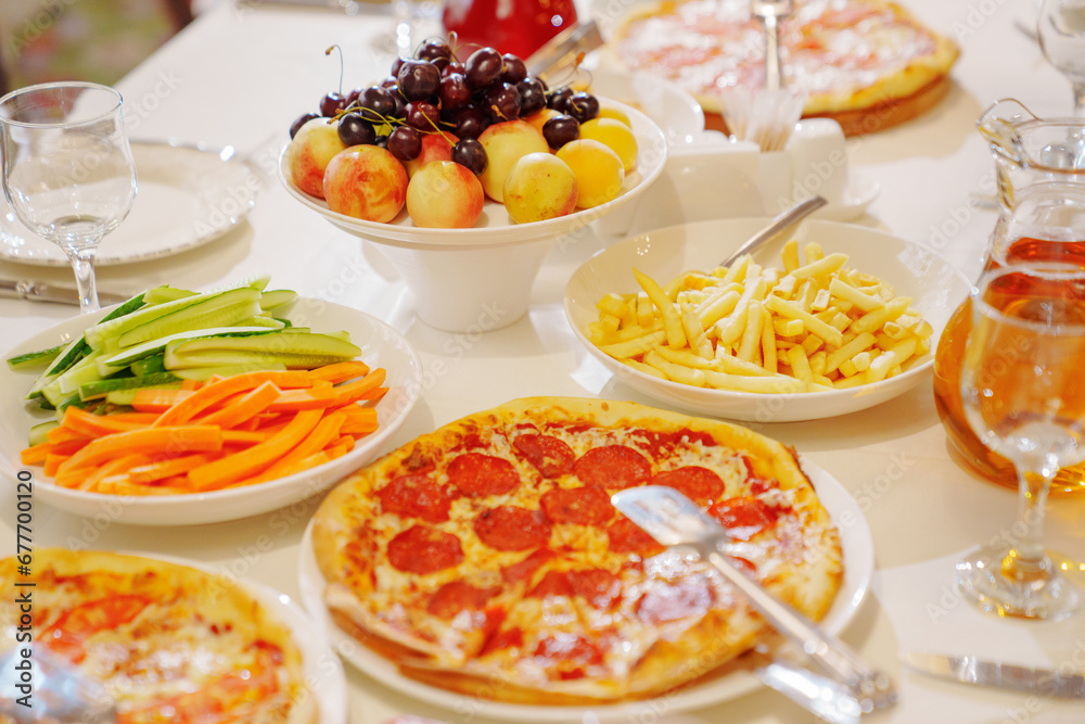 A table served for a children's party with children's favorite fast food. A table served for a children's party with children's favorite fast food.