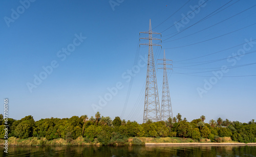 Power transmission lines on the banks of the River Nile