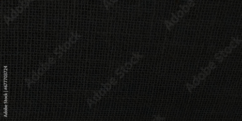 Black abstract Hessian or sackcloth fabric or hemp sack texture background. Wallpaper of artistic wale linen canvas. Blanket or Curtain of cotton pattern with space for text decoration. Light pattern.