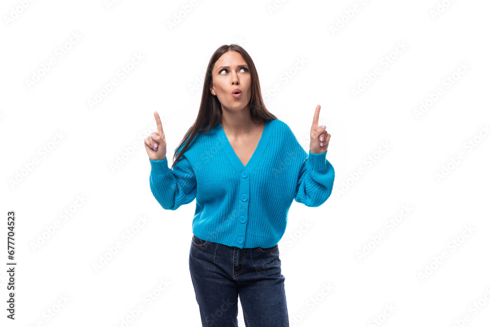 charming caucasian woman with black hair is dressed in a blue sweater on a white background. people lightstyle concept