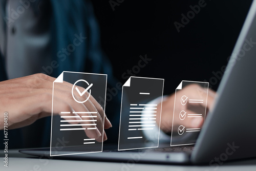 Businessman use laptop with approve document on virtual screen for business process workflow illustrating management approval and and project approve concept. photo