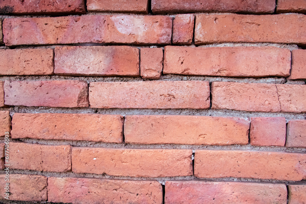 Red brick walls are neatly stacked, beautiful and natural to an ancient construction site.