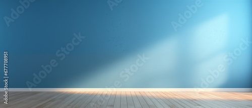 interior with an empty blue wall and wooden floor photo