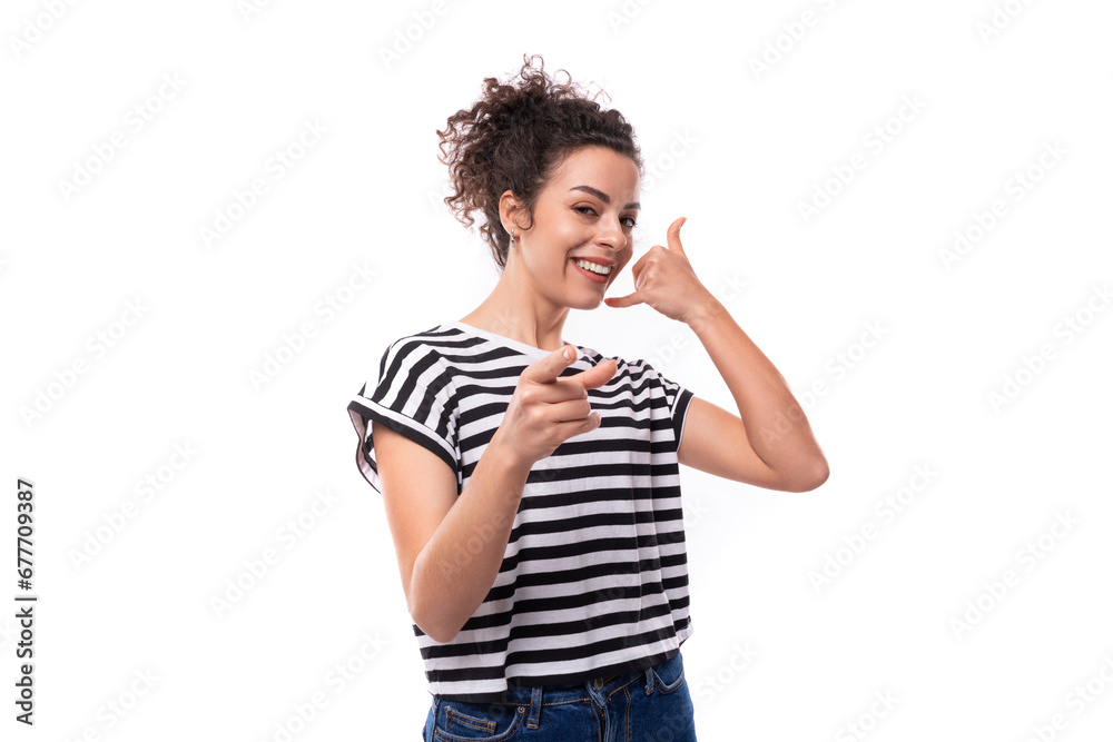 young optimistic well-groomed curly woman in a summer t-shirt smiling broadly young optimistic well-groomed curly woman in a summer t-shirt smiling broadly