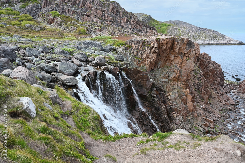 Beautiful waterfall in Teriberka. Arctic, Russia.