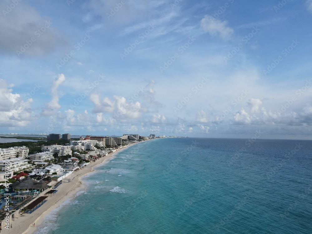 Aerial shot of the coastal city of Cancun with hotels and resorts in front of the sea, Mexico