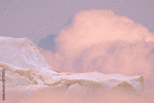 Surreal stone podium table top in outdoor on blue sky gold pink pastel soft cloud background.Beauty cosmetic product placement pedestal present promotion stand display,summer paradise dreamy concept.