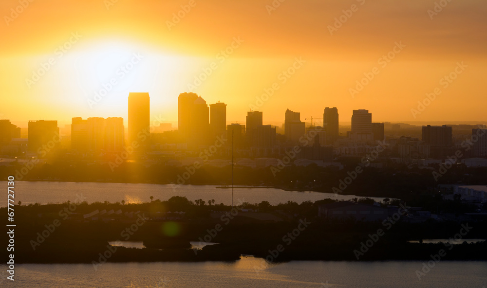 View from above of contemporary high skyscraper buildings in downtown district of Tampa city in Florida, USA at sunset. American megapolis with business financial district