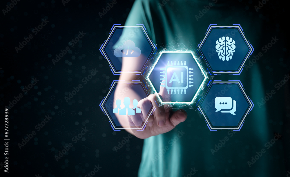 Woman hands working on computer and data theme hologram HUD. Tech concept. Ai hologram with digital human head on dark background. Machine learning, artificial intelligence and conversation assistant.