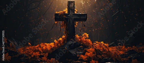  a cross sitting on top of a pile of leaves next to a cross in the middle of a forest filled with yellow leaves.