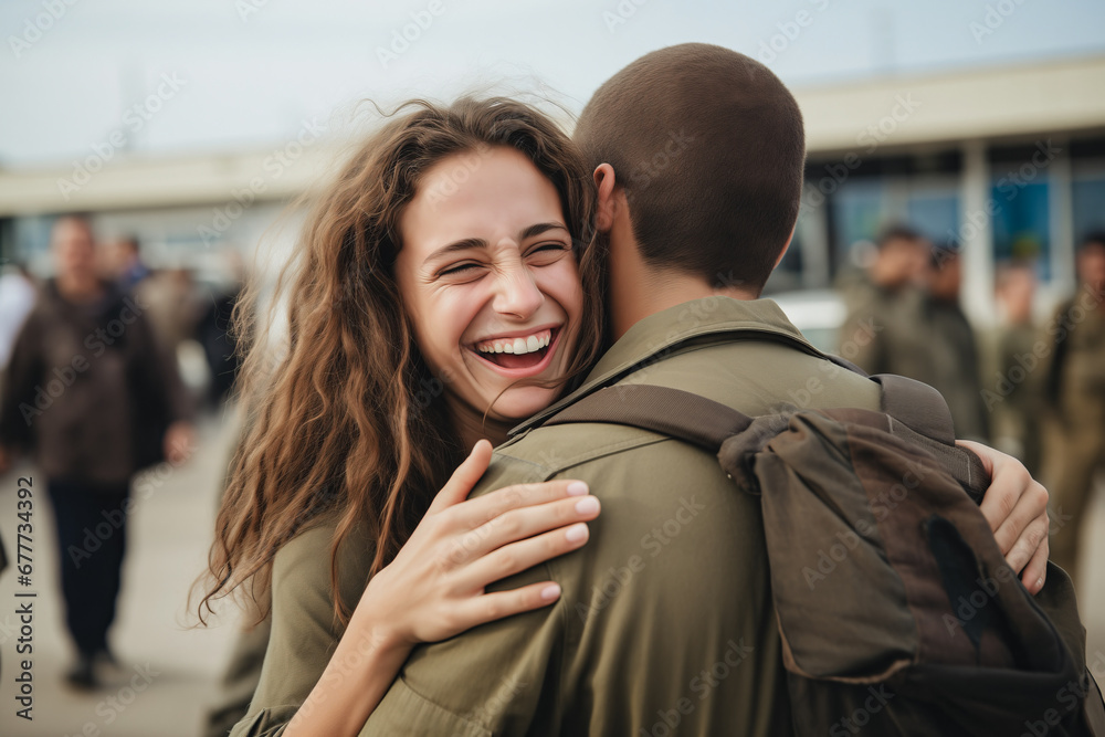 Soldier returning home after military mission of war. Emotional family reunion, girlfriend hugging Israel soldier young man boyfriend
