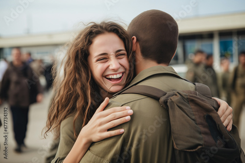 Soldier returning home after military mission of war. Emotional family reunion, girlfriend hugging Israel soldier young man boyfriend