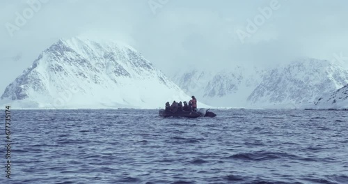 Researchers on a Rib Zodiac research boat in the Arctic Circle, Svalbard