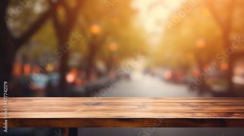 empty wooden table top for product display montages with blurred street view background photo