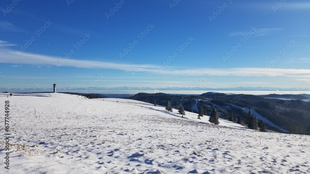 Beautiful winter landscape of snow-covered mountains under a cloudy sky