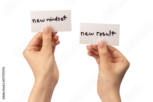 New mindset - new result  text on a card in a woman hand.