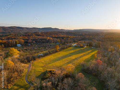 Rural land with mountains in the distance during sunset