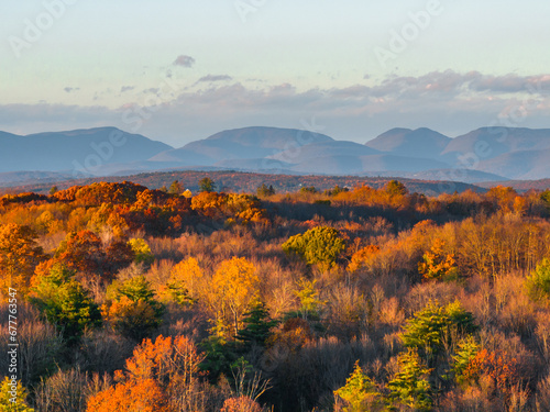Fototapeta Naklejka Na Ścianę i Meble -  Autumn Sunset with Mountains in the Background