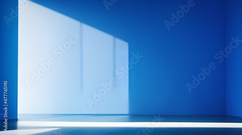 For design or creative work  This is a beautiful blue backdrop image of an empty area in blue tones with play of light and shadow on the wall and floor. Blue background for product presentation