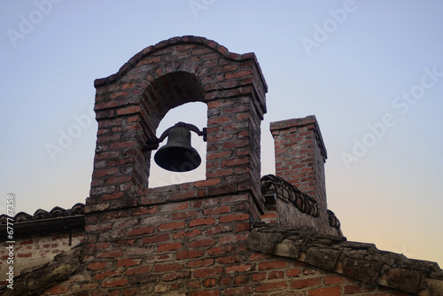 фотографія Sunset Over Whitewashed Andalusian Farmhouse with Bell Tower