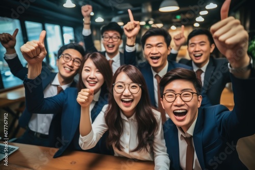 Group of Young Asian business team creative businesspeople coworker in office  Happy to be successful partnership teamwork celebrating achievement and success concept.