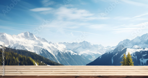 Breathtaking mountain range view from a wooden terrace, under a clear sky. Great place for product placement © Jan