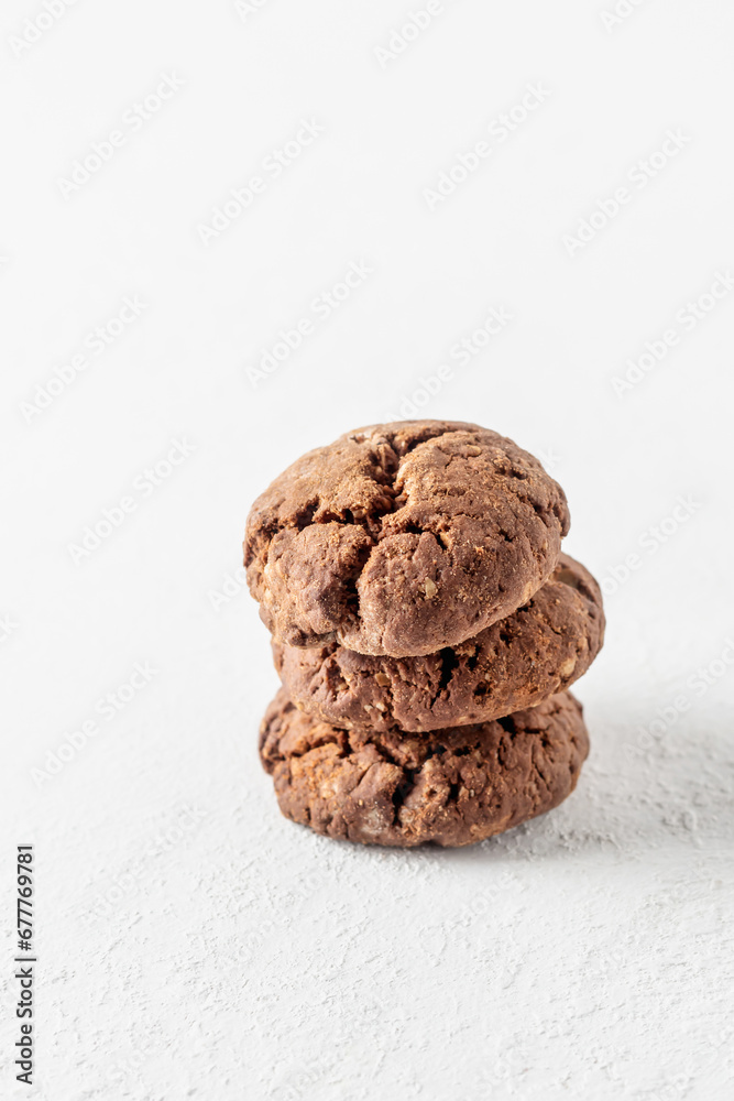 Stack of chocolate brownie cookies with crack on white background isolated. Homemade crinkle cookies Stack of chocolate brownie cookies with crack on white background isolated. Homemade crinkle cookies