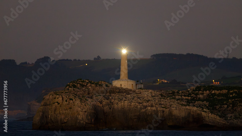 The light of the lighthouse at dusk