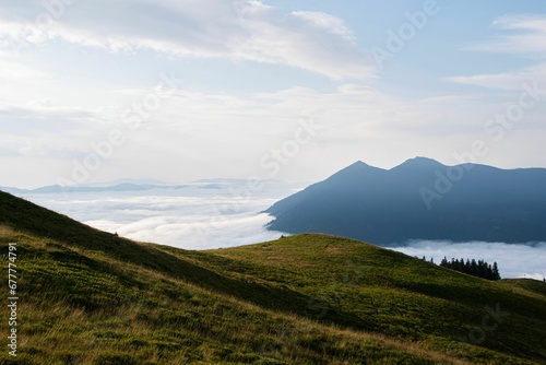 Scenic shot of mountain summits above a sea of clouds