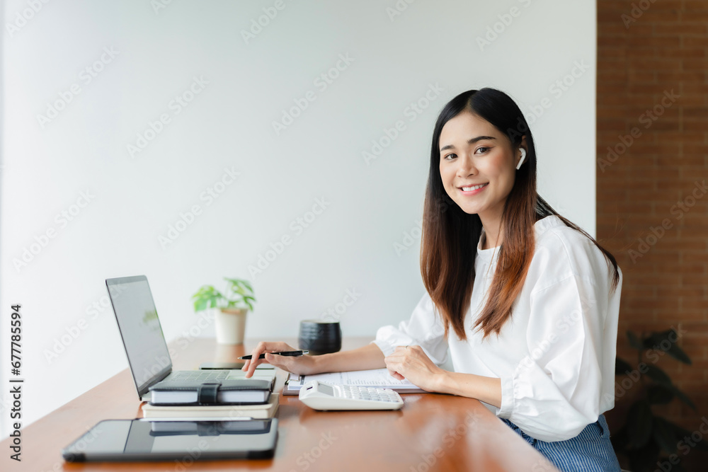 Writer woman calculate and check financial business document with calculator while working in cafe.. Writer woman calculate and check financial business document with calculator while working in cafe..