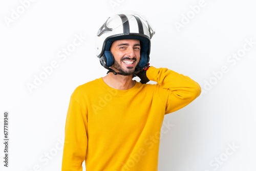 Young caucasian man with a motorcycle helmet isolated on white background laughing