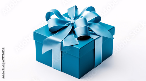A gift box adorned with a ribbon is seen isolated on a pristine white surface. © ckybe