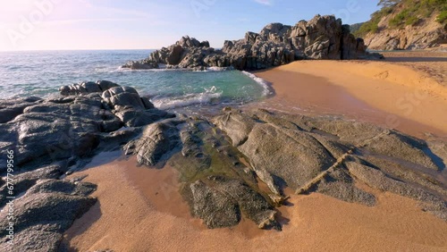 Impressive virgin beach with turquoise blue sea, green vegetation without people, gold sand Lloret De Mar on the Costa Brava of Girona, calm image. Relaxation and copy space photo