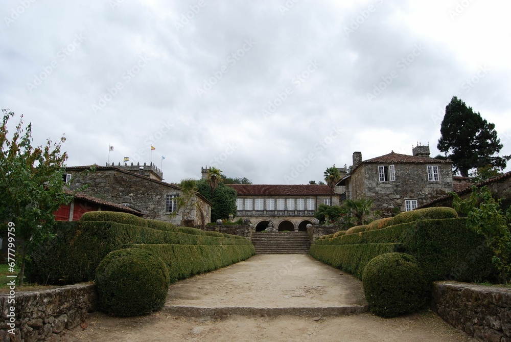 Beautiful view of green historical garden Pazo de Oca with plants and trees in Spain