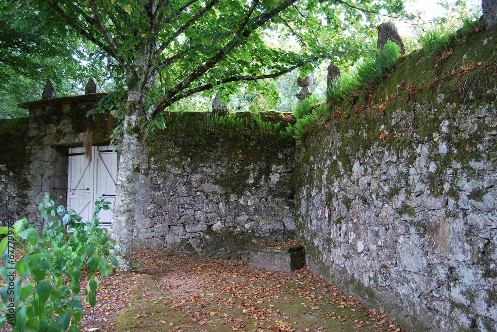 Beautiful view of green historical garden Pazo de Oca with plants and trees in Spain