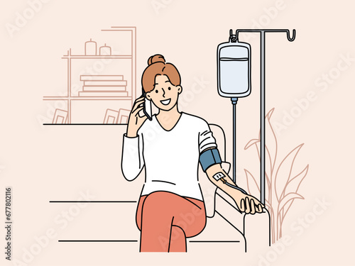 Happy woman receiving dropper with vitamins sitting on couch at home and talking to doctor on mobile phone. Girl with dropper for taking vitamins that improve immunity and health of body