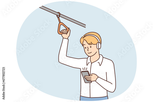Man in headphones with smartphone in transport