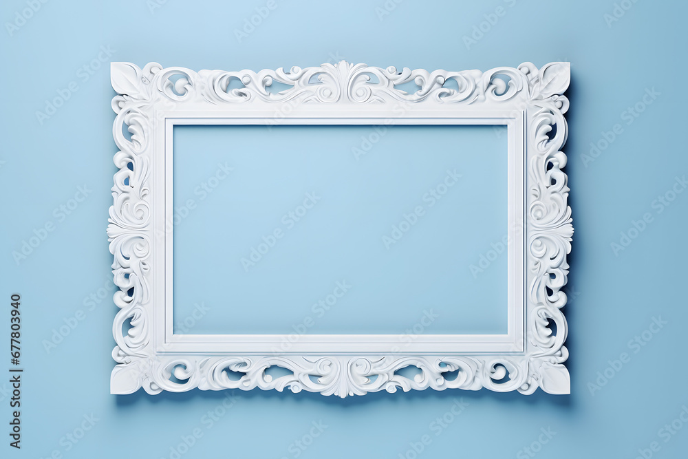 Top view of white baroque style empty picture frame on pastel blue background Top view of white baroque style empty picture frame on pastel blue background