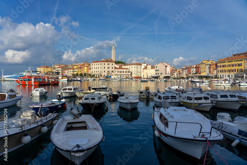 boats in the harbor with Rovinj with the adriatic sea background