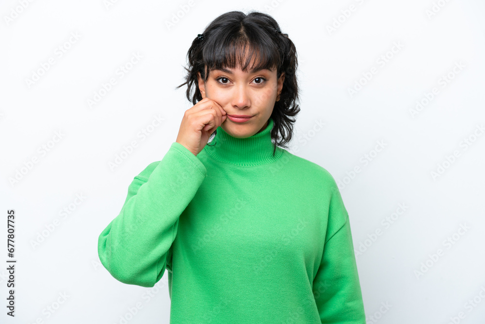Young Argentinian woman isolated on white background showing a sign of silence gesture Young Argentinian woman isolated on white background showing a sign of silence gesture