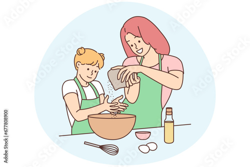 Happy mother and daughter cooking together