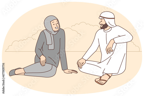 Happy Arabic couple talking outdoors