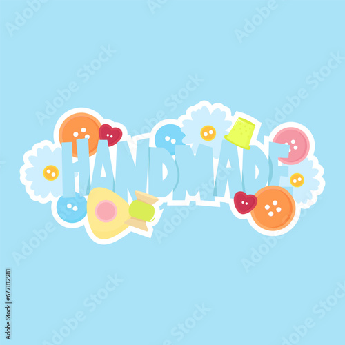 Text handmade with buttons and sewing tools on blue background