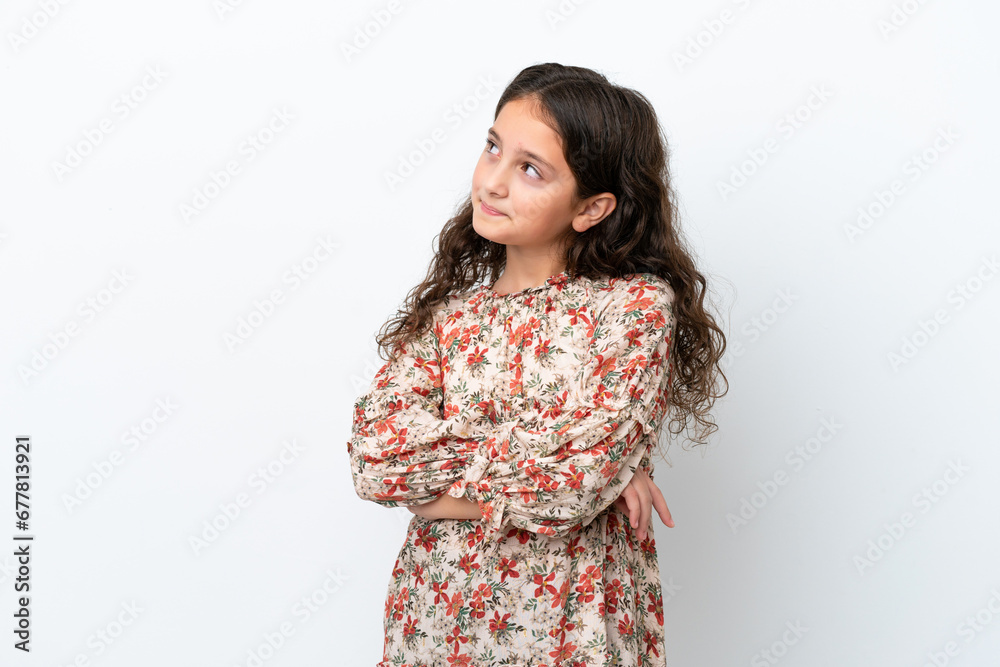 Little caucasian girl isolated on white background looking to the side Little caucasian girl isolated on white background looking to the side