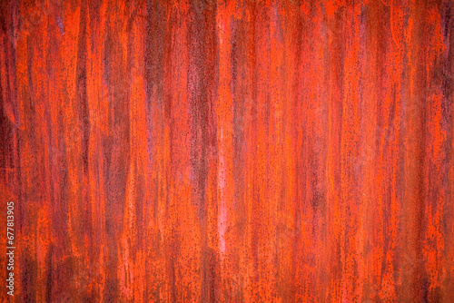 Rusted metal fence in light and shadow