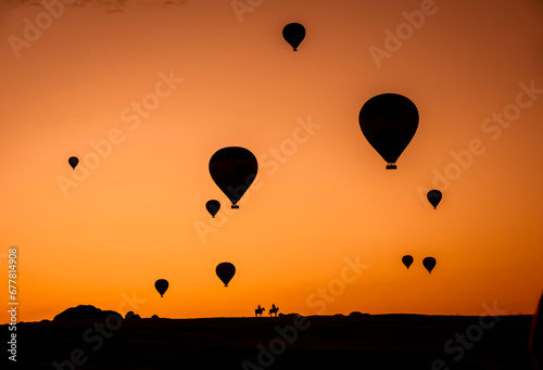 Air balloons at sunset over Cappadocia-Goreme, Turkey, Oct. 20th,2022. A vibrant explosion of light and color, and the enthusiasm of flying an air balloon over the strange rock formation. © Razvan