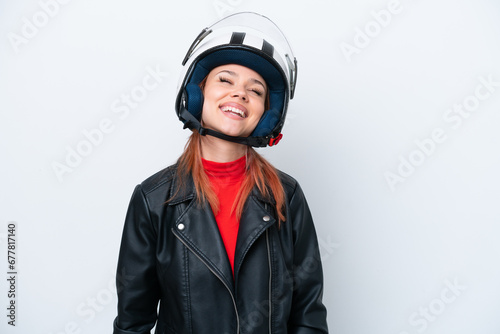 Young Russian girl with a motorcycle helmet isolated on white background laughing