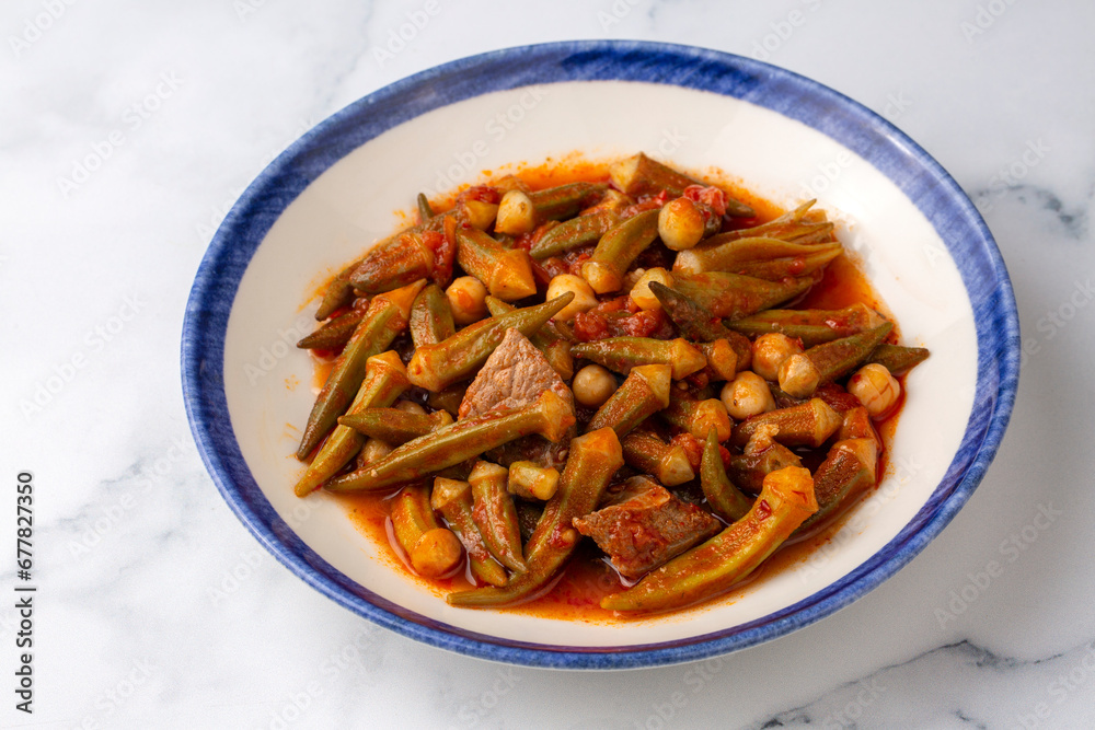 Bamya, Turkish traditional food. (Turkish cuisine) Homemade Food Okra in Plate. Bamya, Turkish traditional food. (Turkish cuisine) Homemade Food Okra in Plate.